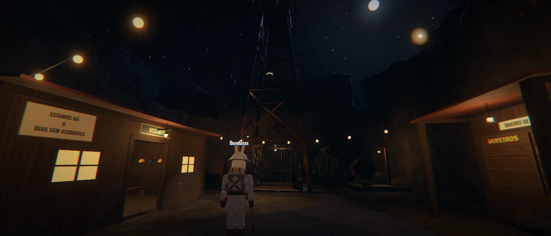 A miner between the wooden sheds of the Old Mine, at night, in front of the cage tower